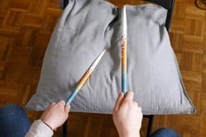 Playing drum sticks to master drumming