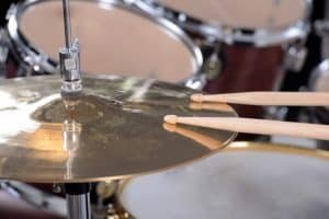 drum set sticks and a disc